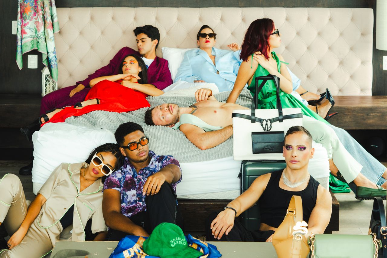 A stylish group of young adults lounging in a modern bedroom in Mexico City, showcasing vibrant fashion and creativity.